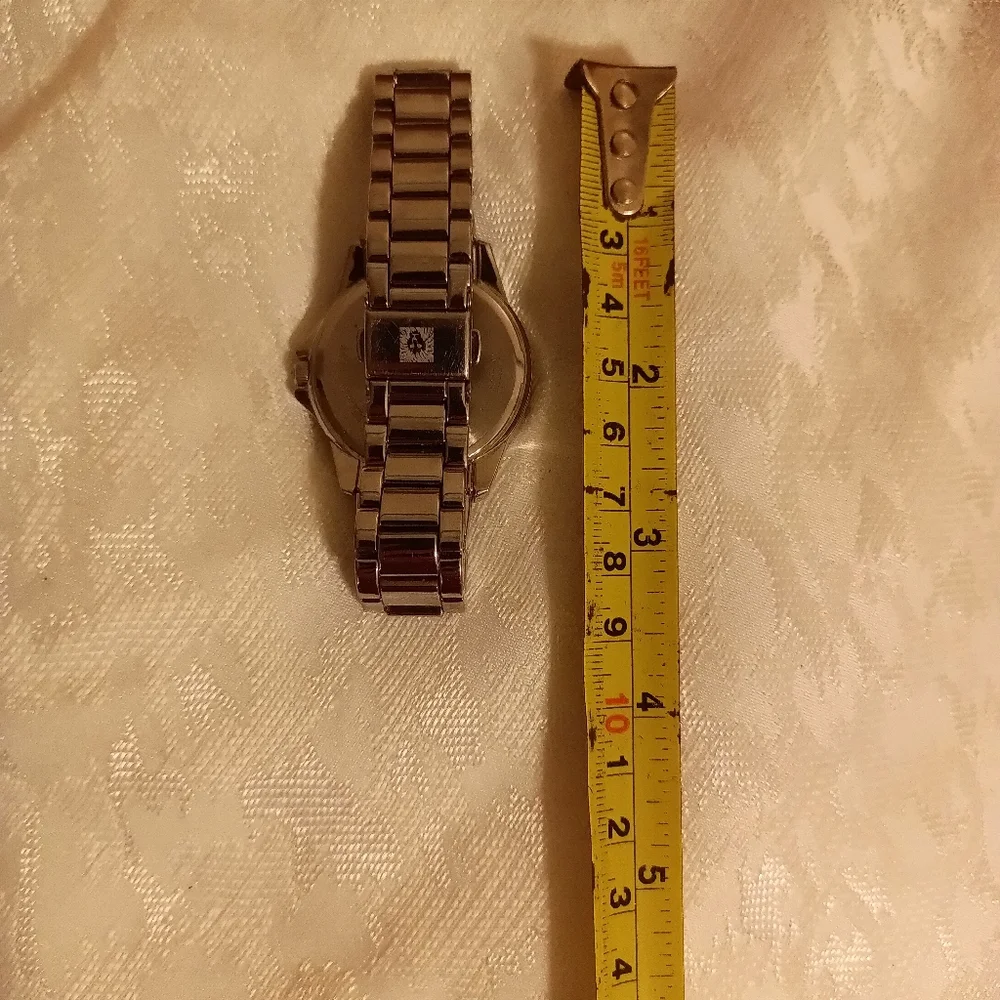 Anne Klein white face outer yellow/ tan second silver tone women's watch